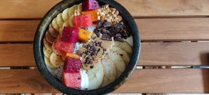 Warm oatmeal with peanut bitter, chocolate, peanuts and fruit at Brew and Breakfast in Da Lat