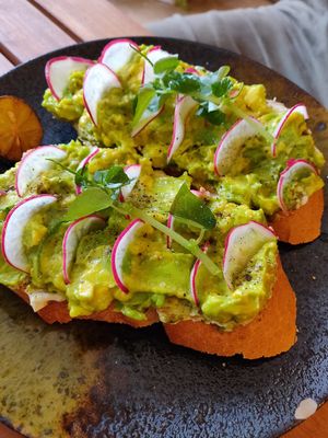 Toast with kale pesto cream cheese, avocado and radish at Brew and Breakfast in Da Lat