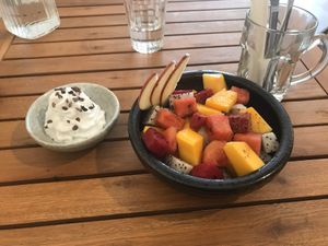 Seasonal fruit with coconut cream (dragon fruit, apple, papaya, watermelon)  at Brew and Breakfast in Da Lat