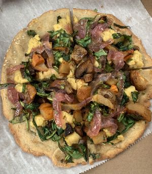 Pizza (I forget what they called it, it had potatoes, “bacon”, pickled onions, etc though 😋)  at Shayna B's By The Sea in Westbrook