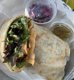 Buffalo tofu wrap with delicious sides!  at Shayna B's By The Sea in Westbrook
