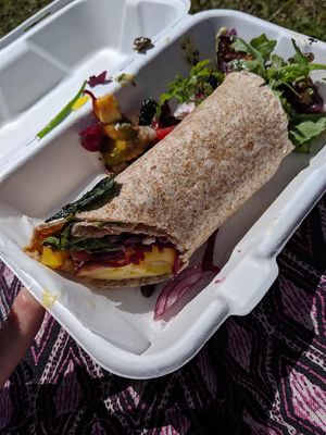 totally delicious wrap stuffed with salad, vegan cheese, gherkins, red onion, sunflower seeds and piccalilli
 at The Mortar & Pestle Vegan Tearoom in Dymchurch
