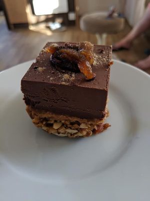 decadent raw chocolate and peanut brownie. Highly recommended. 
 at The Mortar & Pestle Vegan Tearoom in Dymchurch