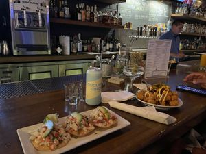 Bar with vegan ceviche and tater tots with vegan chili  at Beelman's in Los Angeles