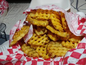 Half order of regular waffle fries with salt and pepper rub at Heavenly Buffaloes in Durham
