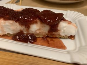 Coconut cheesecake with plum preserve topping    at Peas in Athens