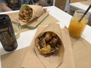 Seitan gyros and their special greek pita with kombucha and fresh orange juice  at Peas in Athens
