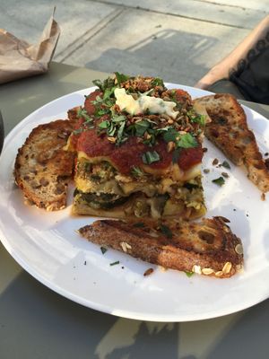 Lasagna and garlic bread at Hello 123 in Toronto