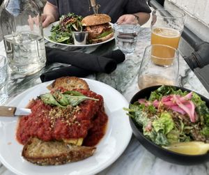 Huge portion of lasagna with sourdough garlic bread and caeser salad. So good!! My friend had the pulled shiitake sandwich and loved it.   at Hello 123 in Toronto