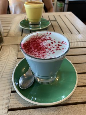 Blue Latte with a Turmeric Latte in the background  at Nature Cafe/Bar in Frankston