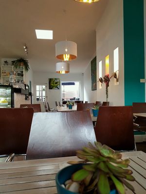 Light filled, music playing, indoor outdoor seating options..  at Nature Cafe/Bar in Frankston