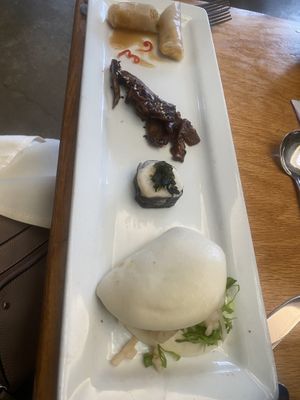 Spring roll in rice paper, marinated mushrooms, sushi roll with turnip, bao bun (dim sum afternoon tea)  at Boulder Dushanbe Teahouse in Boulder