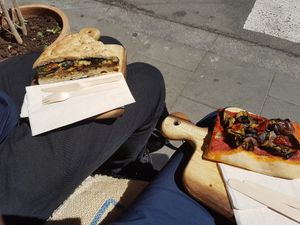 lunch on the bench at the front window at Nabucco Obrador Vegetaria in Barcelona