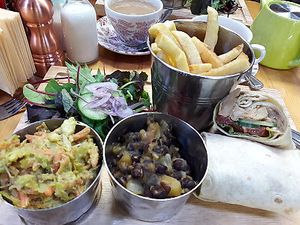 Jerk jackfruit wrap with fries, avocado slaw & mango & black bean salsa  at The Barn in Scorton