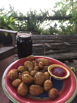 Jamaica juice and mini roasted potatoes with homemade red sauce  at Maracuya in Flores