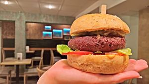 Vegan RedBean burger in hand at VEG in Poprad
