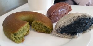 Green bagel and sweet buns with fillings (flavors: chocolate and black sesame)
 at yummyyomil in Seoul