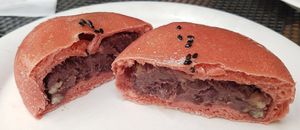 Sweet bun (red rice flavor) filled with cream and red bean paste.
 at yummyyomil in Seoul