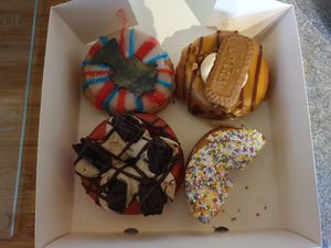 Clockwise, starting top left: Queen Liz (limited edition for Platinum Jubilee), David Hasselhoff, Fairy Godmother (already ate half before taking the photo sorry), Liam Hemsworthy at Rodeo Doughnuts - Shaftesbury Ave in London