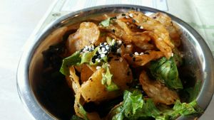 Great combination of potato chips, greens and sauce. at Pirate's Bone Burgers - Crossroads in Kansas City