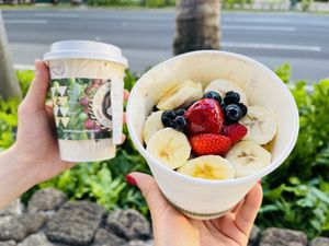 Tiny matcha latte and acai bowl  at Island Vintage Coffee in Honolulu