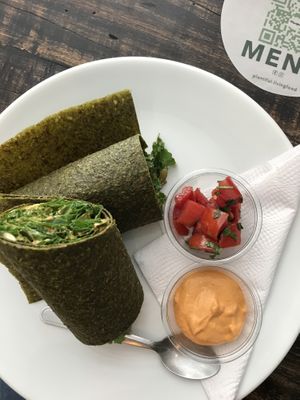 Kale enchilada wrap. The actual wrap has a really good flavor. Great sauce  at Plantiful in Guatemala City