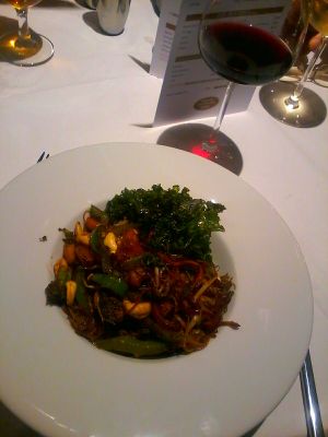 Pineapple and cashews nut stir fry with ricr noodles, crispy kale at Crimble Hall in Rochdale