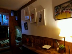 inside, art prints for sale and the downstairs seating area at O Burrito in Porto