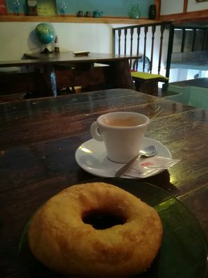 yum donut and coffee  at O Burrito in Porto