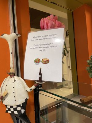 sign about portobello mushrooms as meat option   at Olive Oil Cafe in San Diego