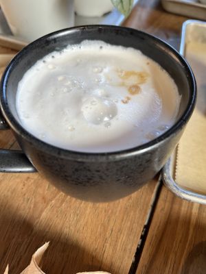 Latte with almond milk (too much foam!)  at Red Barn Bakery in Irvington
