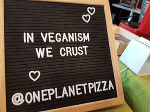 stall at VegfestUK, London at One Planet Pizza in Norwich
