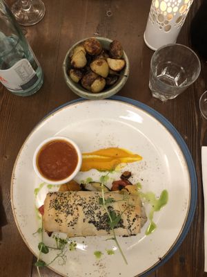 The mushrooms in filo dough on a layer of roasted veggies and a side of roast potatoes (or you can choose fries) at Trattoria AD 1530 in Mdina
