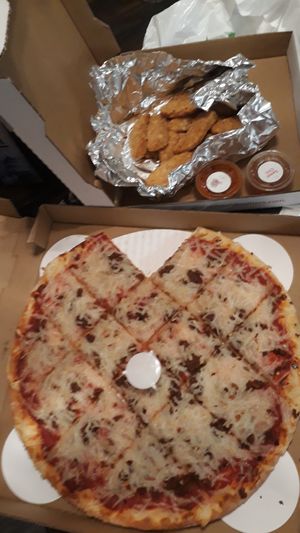 Vegan pizza with sausage & 1 pound of nuggets at Fresh Brothers  in Marina Del Rey