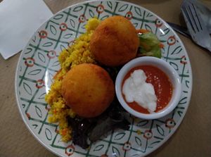 Bombas de patatas picantonas rellenas de boloñesa at Verdetariano in Sevilla