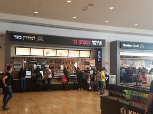 In the food Hall on the left at TLV - Aroma - T3 in Tel Aviv