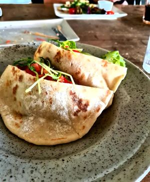 Home-made Pita bread with grilled veggies, young peas and pea dip at Berlinka Cafe in Bratislava