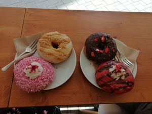 The place is so cozy and sweet. I went specially for the donuts and it's worthy. Fresh, fluffy and different tastes. The salty dishes were looking tasty too, but I didn't try. The  at Vegan Food & Sweet Bar in Brno