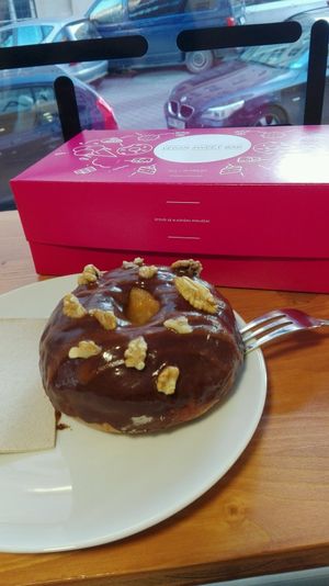 donut with chocolate and apricot jam topping at Vegan Food & Sweet Bar in Brno