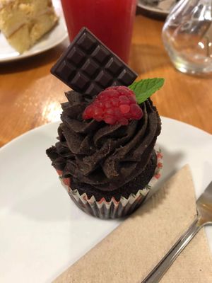 Cute little vegan muffin with little chocolate on top!  at Vegan Food & Sweet Bar in Brno