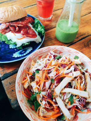 Papaya salad, egg & bacon burger, green smoothie, watermelon juice. at Chookie's Beer Garden in Ninh Binh