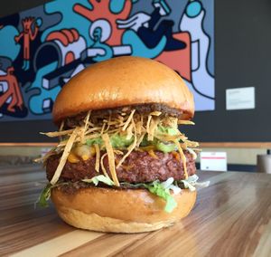 Blant-based Taco Burger! Make it vegan by removing the bun and cheese. at Grub Burger Bar in The Woodlands