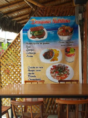 Poster of veg options including veg burgers and veg ceviches at Carmita's Pancake House Restaurant in Montanita