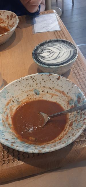 Plum gazpacho and charcoal oat vanilla latte at My Mother's Daughters  in Lisbon