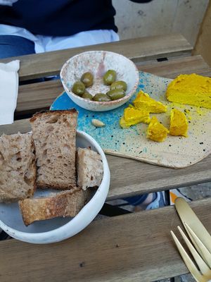 Delicious bread, olives, and Gary at My Mother's Daughters  in Lisbon