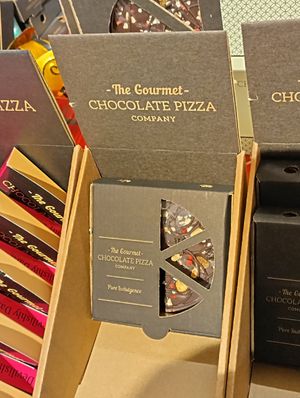 Dark Chocolate pizza with nuts and dried fruit at Wholesome Bee in Settle