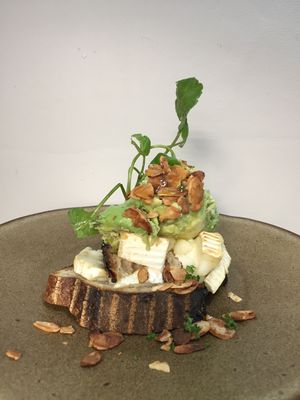 Goats cheese and smashed avocado with smoked almonds and chilli oil at Partisan in York