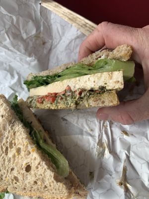 Baked tofu with walnut pesto, red peppers, vegan mayo   at Karma Road Organic Cafe in New Paltz