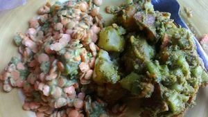 Picture of two salads from the deli case purchased recently by weight. On the left is a raw lentil salad and on the right, a (two-)potato salad. at Karma Road Organic Cafe in New Paltz