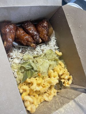 Sweet and spicy wings w cabbage and Mac and rice and peas. So bomb!   at Vegan International Co in Tampa